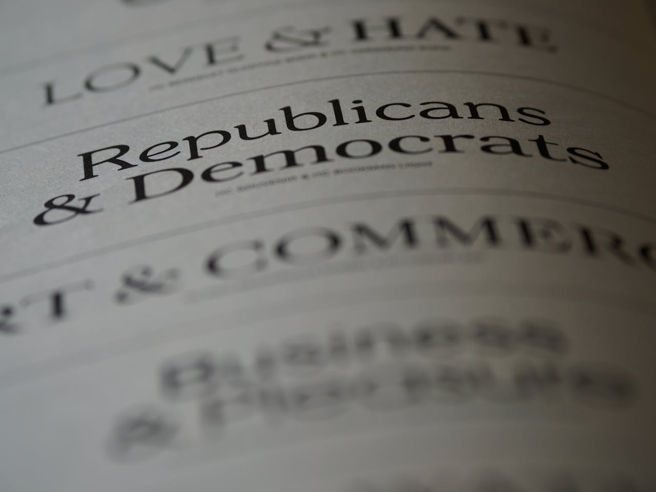 Close-up of blurred text page with 'Republicans & Democrats', focusing on political themes.